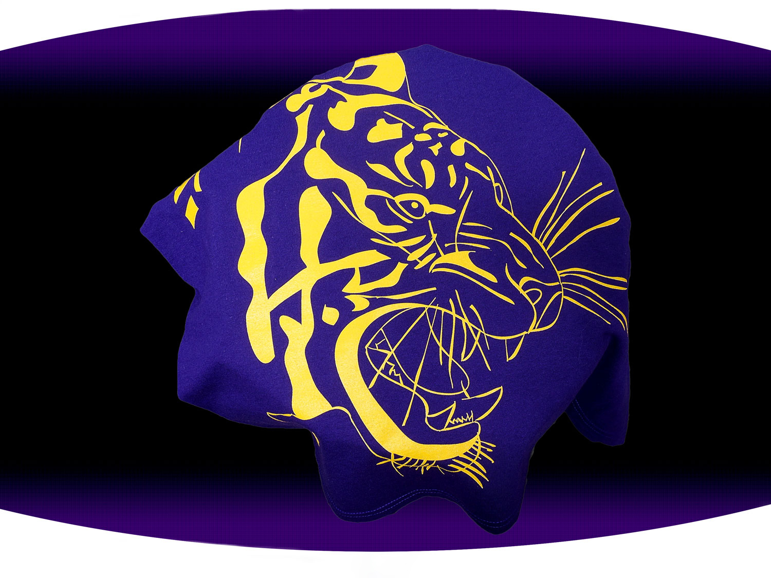 Close up of purple screen printed  LSU t-shirt with a gold outline of a tiger face